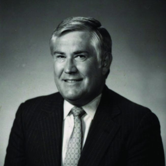 Black-and-white portrait of a man in a suit