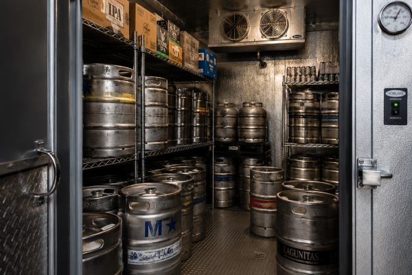Kegs stored in a walk-in refrigeration room