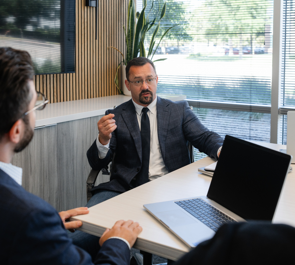 People discussing business around an office table